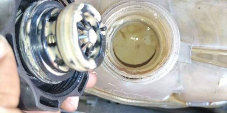 oil in coolant reservoir but car not overheating